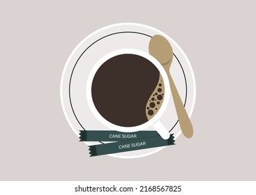 A top view of a cup of black coffee on a saucer with cane sugar packs