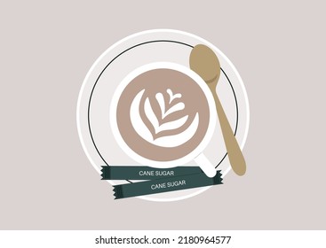 A top view of a cup of cappuccino on a saucer with cane sugar packets