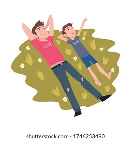 Top View of Dad and his Son Lying on Green Grass, Family Members Spending Joyful Time Together Outdoors Cartoon Style Vector Illustration