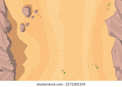 Top view of desert landscape with a sandy expanse and subtle texture. Features rugged cliffs on both sides, scattered rocks, and small green bushes. Aerial. View from above.