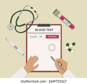 Top view of a doctor's desk. Blood tube, coronavirus test, stethoscope, pills and thermometer. Covid-19