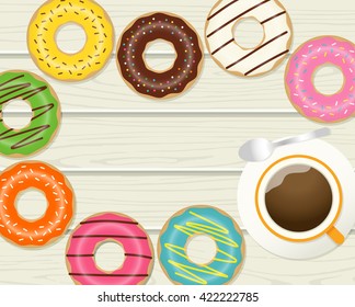 Top view of donuts and coffee cup on wooden background with copy space.