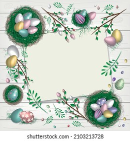 Top view of empty card surrounded by baskets with chocolate eggs and easter eggs, foliage and twigs on white wooden textured background