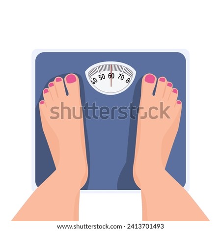 Top view of female feet standing on weighing scale Сток-фото © 
