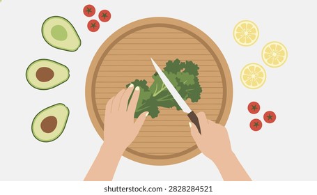 Top view of a food preparation area shows human hands slicing fresh green herbs on a wooden cutting board with avocado halves and red cherry tomatoes.