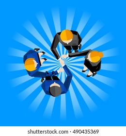 top view of four business partners shaking hands on striped blue background.