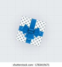 Top view of gift box with blue bow and ribbons. Spotted gift box vector template.