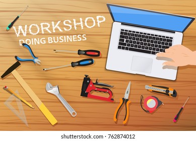 Top view hand pushing button on computer and home tools