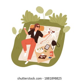 Top view of happy young woman resting outdoors and lying on picnic blanket and petting her cat. Relaxing alone and spending time in nature at summer. Flat vector illustration