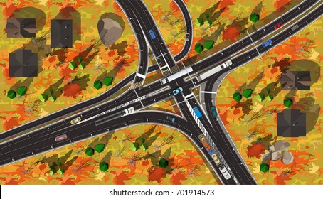 Top view high speed autobahn with cars and trucks in autumn with yellow leaves on trees