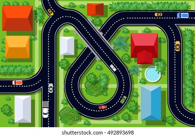 Top view of a highway junction and a traffic intersection in the city with houses, trees and streets