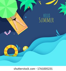 Top View of Human Lying on Sunbed with Umbrella, Trees, Swimming Ring, Beach Ball and Blue Paper Layered Cut Waves for Hello Summer Concept.