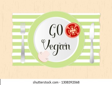 Top view Illustration Go Vegan on a plate with tomato and mushroom slices on a wooden  background