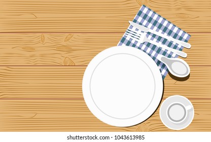 Top view of kitchenware on wooden background. Empty dishes with fork, knife and kitchen towel. Copy space.