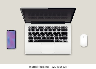 Top view of laptop computer with open screen monitor, mouse and smart phone