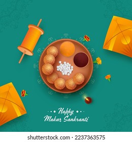 Top View Of Makar Sankranti Festival Elements On Teal Green Mandala Pattern Background.