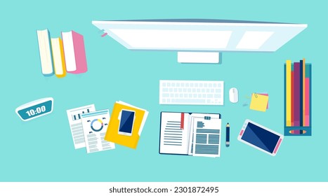 Top view of an office desk with desktop computer, books, phone and office items 