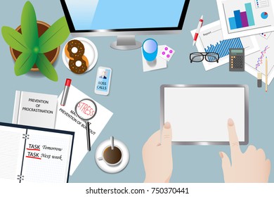 Top view of the office desk with objects, book of procrastination, open diary and ringing phone. Hands holding the tablet point to a blank screen ready for your text.