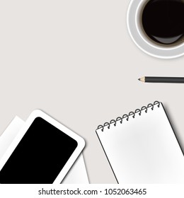 top view office table with Notepad and Tablet,cup of  coffee,pencil ,paper and smartphone, business concept design