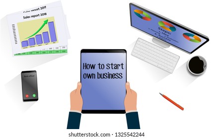 Top view on hands with laptop with text How to start own business above desk with mobile, tablet and other business accessories. Modern business workplace