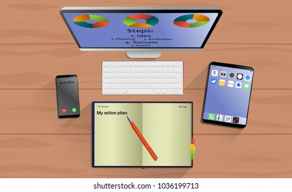 Top view on laptop computer with mobile phone and tablet on office desk. With Business notebook (diary) with text action plan. Modern business workplace