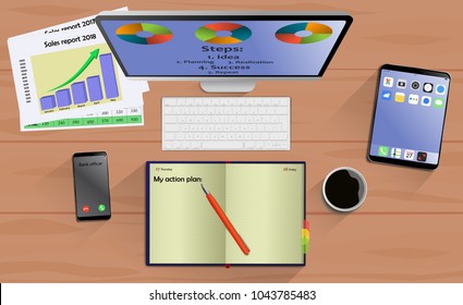 Top view on laptop computer with mobile phone and tablet on office desk. With Business notebook (diary) with text action plan. Modern business workplace