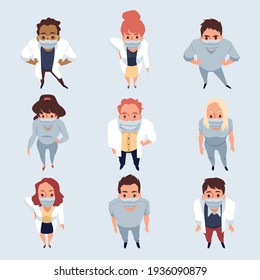 Top view on standing and look up people in protective facial masks.