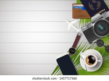Top view on travel and vacations concept over wooden background