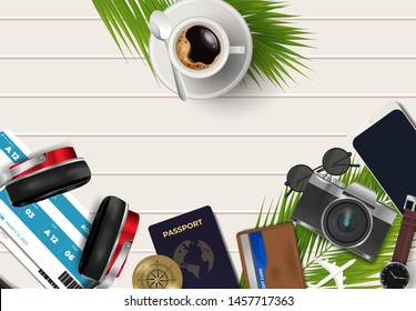 Top view on travel and vacations concept over wooden background