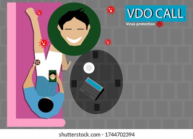 The top view of the people who are lying on the pink sofa  And talking on the phone with friends face to face  , He was at home to prevent the Covid virus infection.  -19 in the epidemic