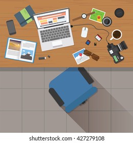 Top view of photographer working desk with stuff and laptop