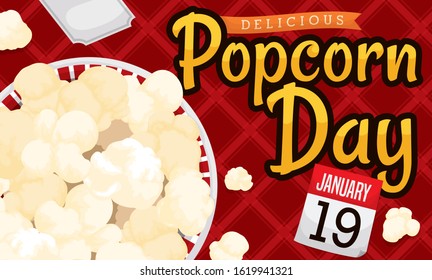 Top view of picnic elements to celebrate Popcorn Day: delicious corn popped served in a bowl, square tablecloth and reminder calendar for this special event in January 19.