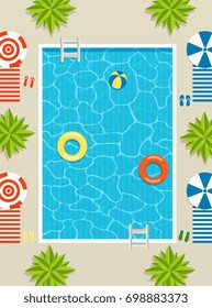 Top view of pool with sun loungers and umbrellas, palm trees and