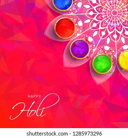 Top view of poster or greeting card design with color bowls on mandala decorated abstract background for Holi festival celebration.