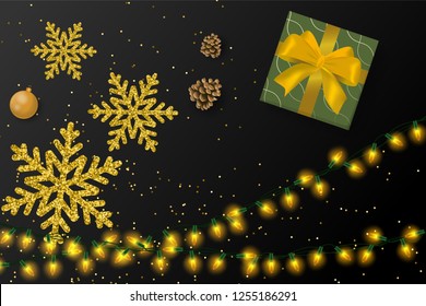 top view of present gift box with gold ribbon bow with snowflakes and christmas light. concept design for greeting card, banner or sales promotion on christmas and new year seasonal in vector