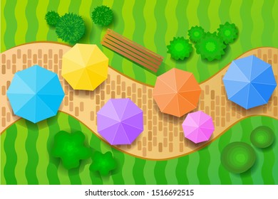 Top view rainbow umbrella on walk street in the garden