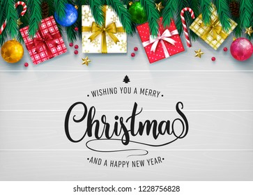 Top View Realistic Holiday Greeting Card in Gray Color Wooden Background with Christmas Elements Design Like Gift, Pine Cone, Star, Snow Flakes and Wishing You A Merry Christmas and Happy New Year Me
