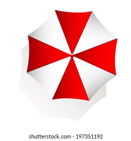 Top view of red and white beach umbrella on white background