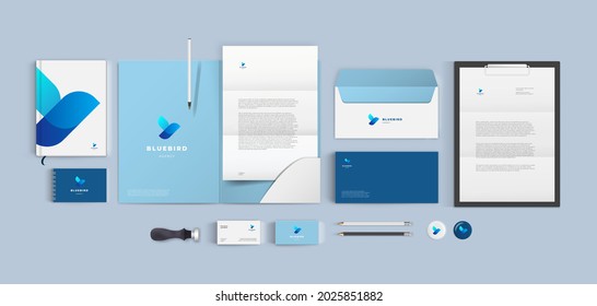 Top view stationery design mock up set for corporate identity or branding on table. Blue color style and grey background. Realistic bundle with folder, letter, envelope and business card.