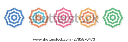 Top view of stiped beach umbrellas, for use in summer vacation brochures, beach resort advertisements, and holiday travel graphics