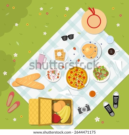 A top view of a summer picnic with various foods on green grass. Vector illustration in flat design style.
