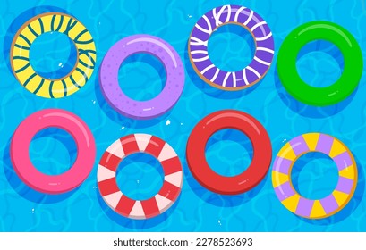 Top view of the swimming pool with colorful floating inflatable circle floaters perfect for summer. 