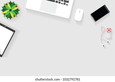 Top view of table working and working desk with gadget and free space for text with accessory on the table, notebook, phone, laptop, tablet, flowerpot and coffee cup