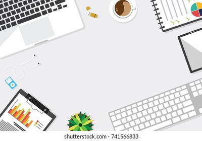 Top view of table working and working desk and free space for text with accessory on the table, laptop, notebook, keyboard, phone, pen, coffee cup, flowerpot, flash drive, note