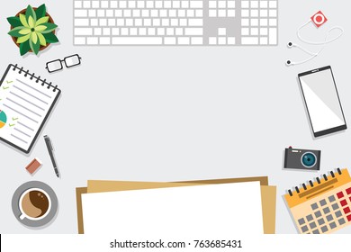 Top view of table working and working desk with gadget and free space for text with accessory on the table, notebook, keyboard, pencil, pen, coffee cup, glasses, flowerpot, camera, note