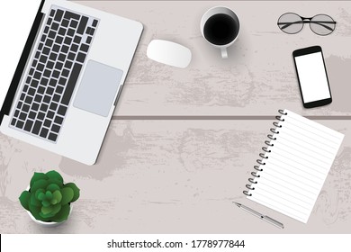 Top view with textured table, laptop and telephone as well as books and mouse and coffee. In the center of the table is a folder-plate with white sheets for your text