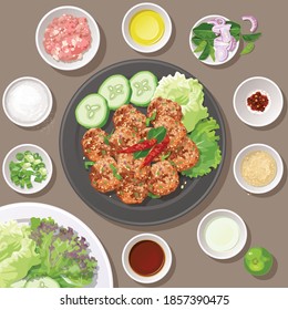 Top view of Thai food, fried spicy minced pork salad with ingredients. (Larb Moo Thod)