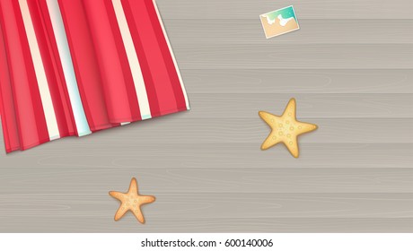 Top view, towel, beach Mat lies on a light wooden background near the starfish and photo. Summer, beach, background with photo, starfishes and copyspace, illustration