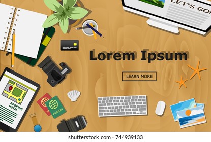Top view of traveler desk, plan for the trip with with copy space for text on wooden, empty note book camera with lens, trekking map, tablet search for hotel, passport, photos of vacation place.