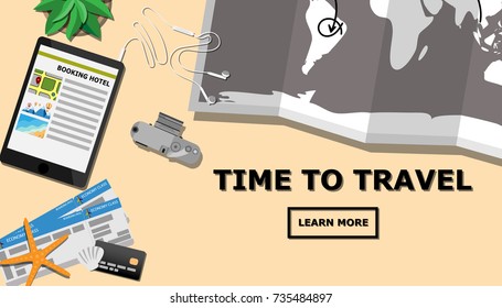 Top view of traveler's desk with tablet and planing for the next trip, world's map, credit card, film camera, economy class plane ticket (boarding pass) with copy space for your own text